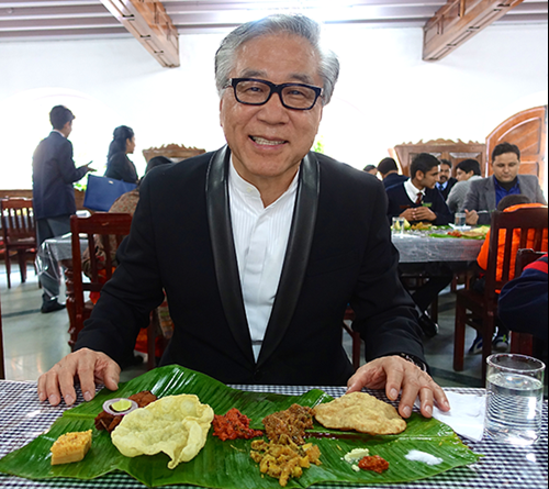 Mr. Sun enjoys banana leaf lunch